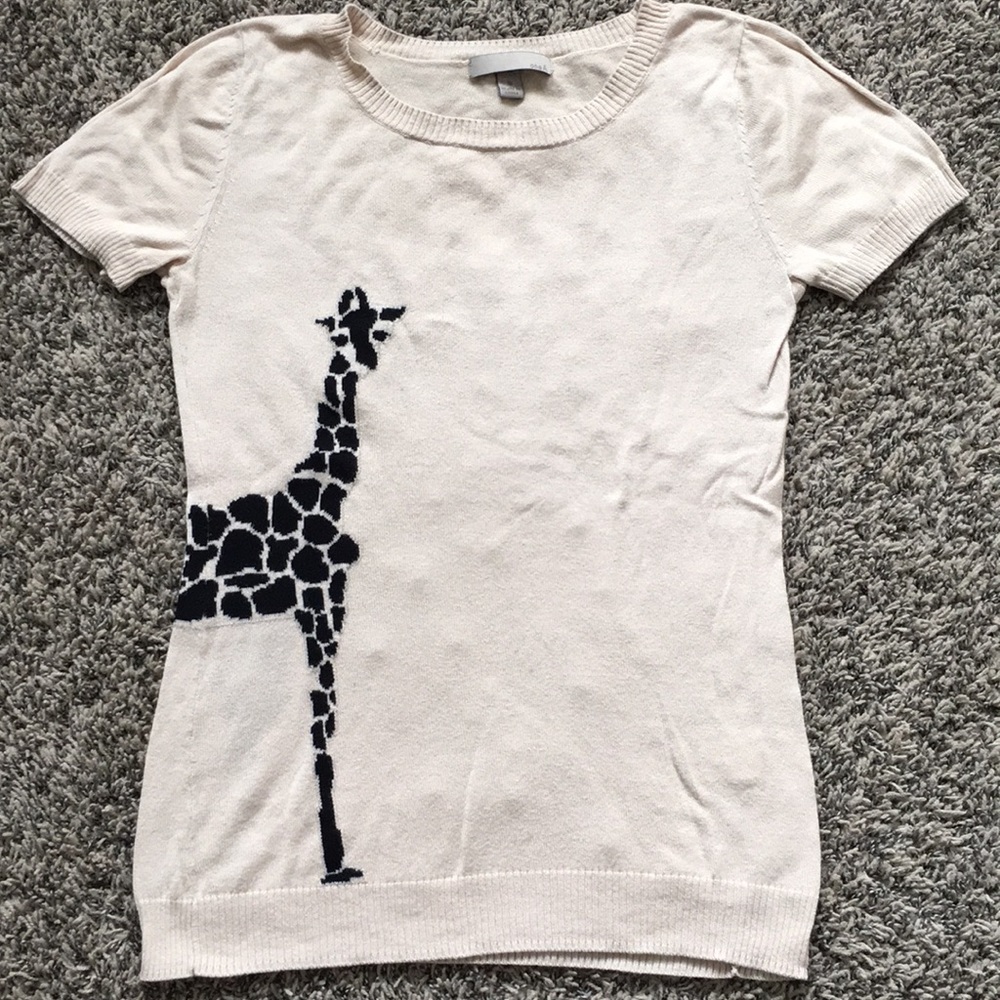 Tan shirt sleeve top with giraffe detail. Size S